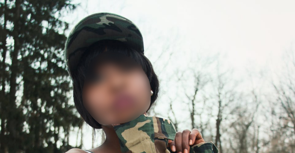 Image of a woman in military fatigues with her face blurred to represent the problem of the military's porn cultureIssue: Military -- Pentagon Watch on Sexual Exploitation