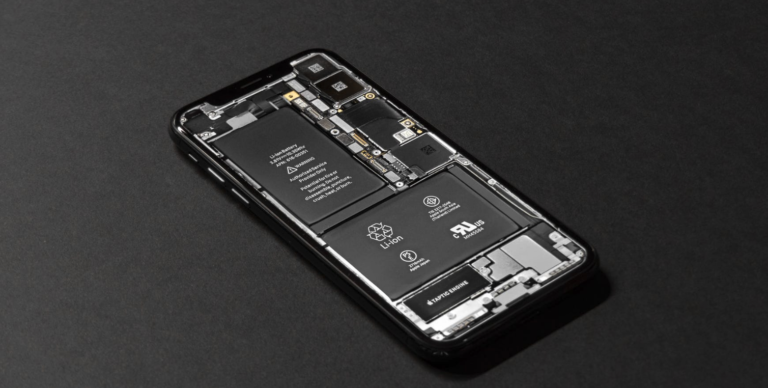 The inner workings of a smartphone representing the manufacturing of smart devices
