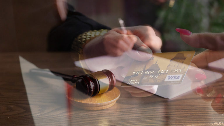 Image of person using a VISA card superimposed over an image of a judge writing a ruling with a gavel nearby